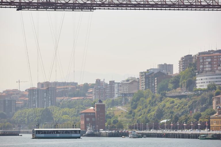 bizkaia-red-iron-hanging-bridge-and-nervion-river-2023-11-27-04-59-34-utc(1)